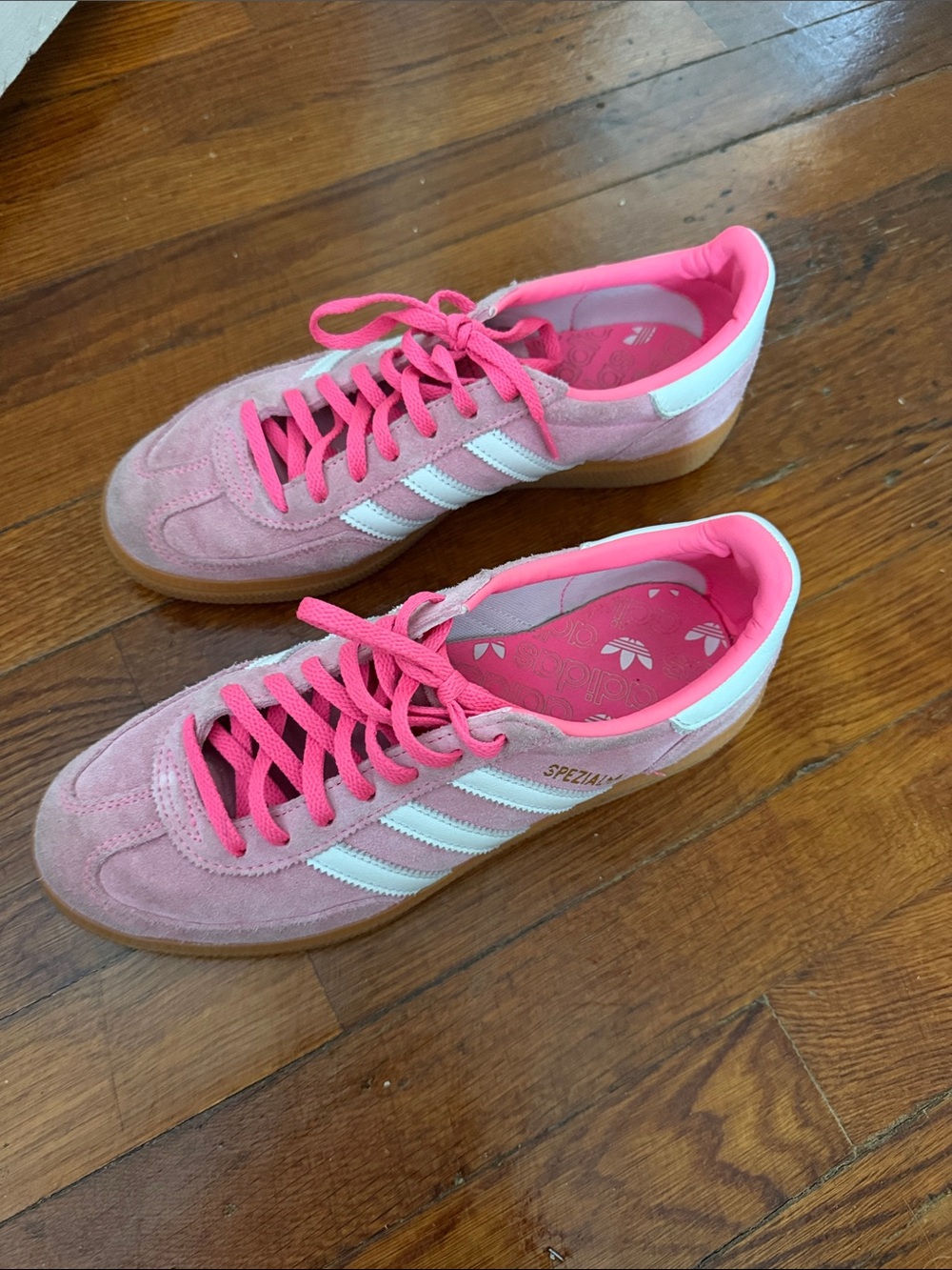 adidas pink suede sneakers with white stripes